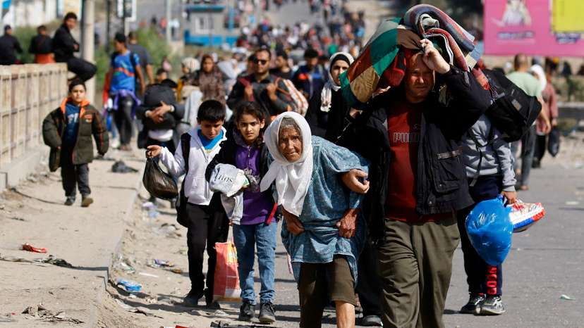 Palestinians fleeing north Gaza move southward, in the central Gaza Strip