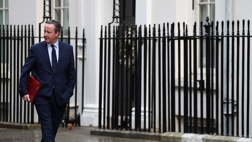 FILE PHOTO: British Secretary of State for Foreign, Commonwealth and Development Affairs David Cameron walks outside 10 Downing Street in London