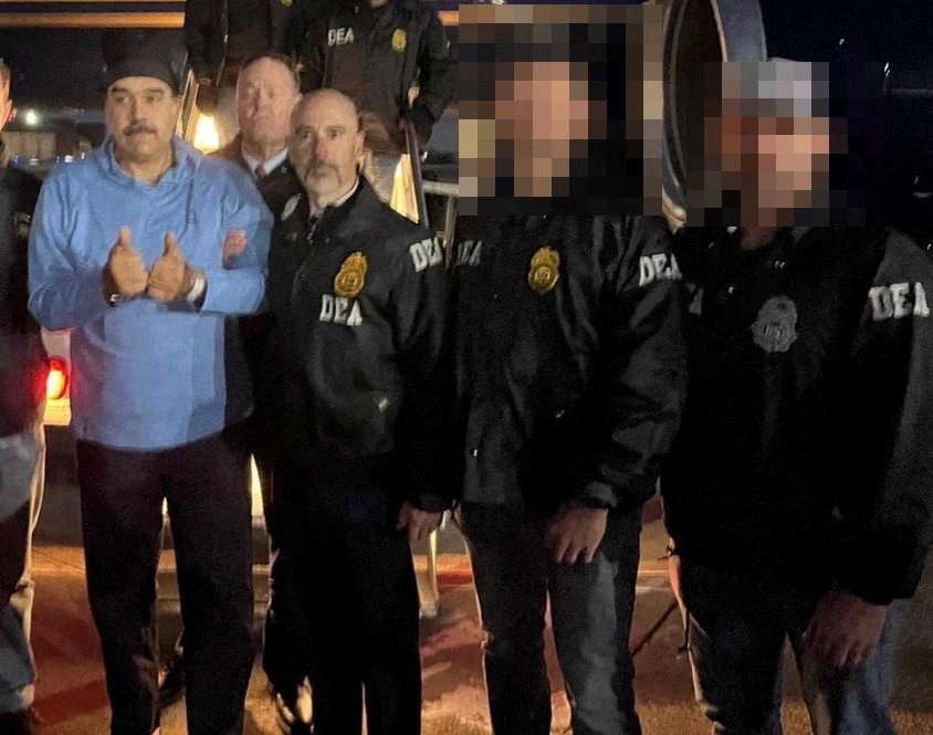 Venezuela's captured President Nicolas Maduro poses next to DEA administrator Terry Cole in Newburgh