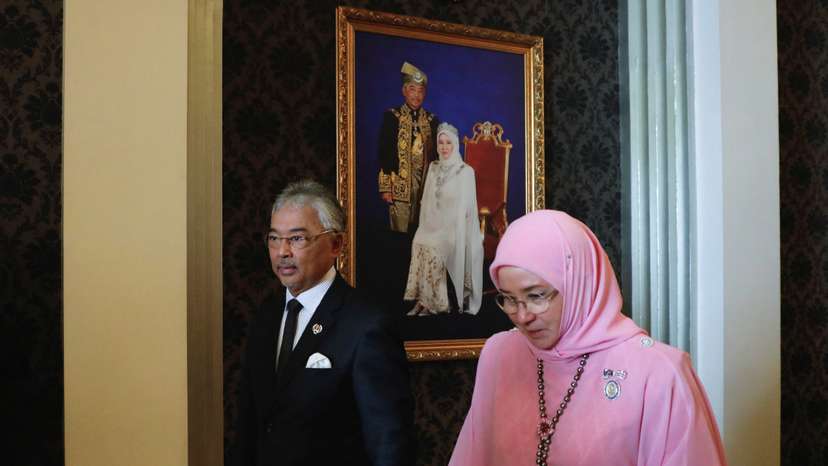 Malaysia's King Al-Sultan Abdullah Sultan Ahmad Shah and Queen Tunku Azizah Aminah Maimunah Iskandariah walk holding hands after an interview, in Kuala Lumpur