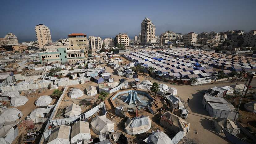 Palestinians displaced by the Israeli military offensive, shelter in tents, in Gaza City