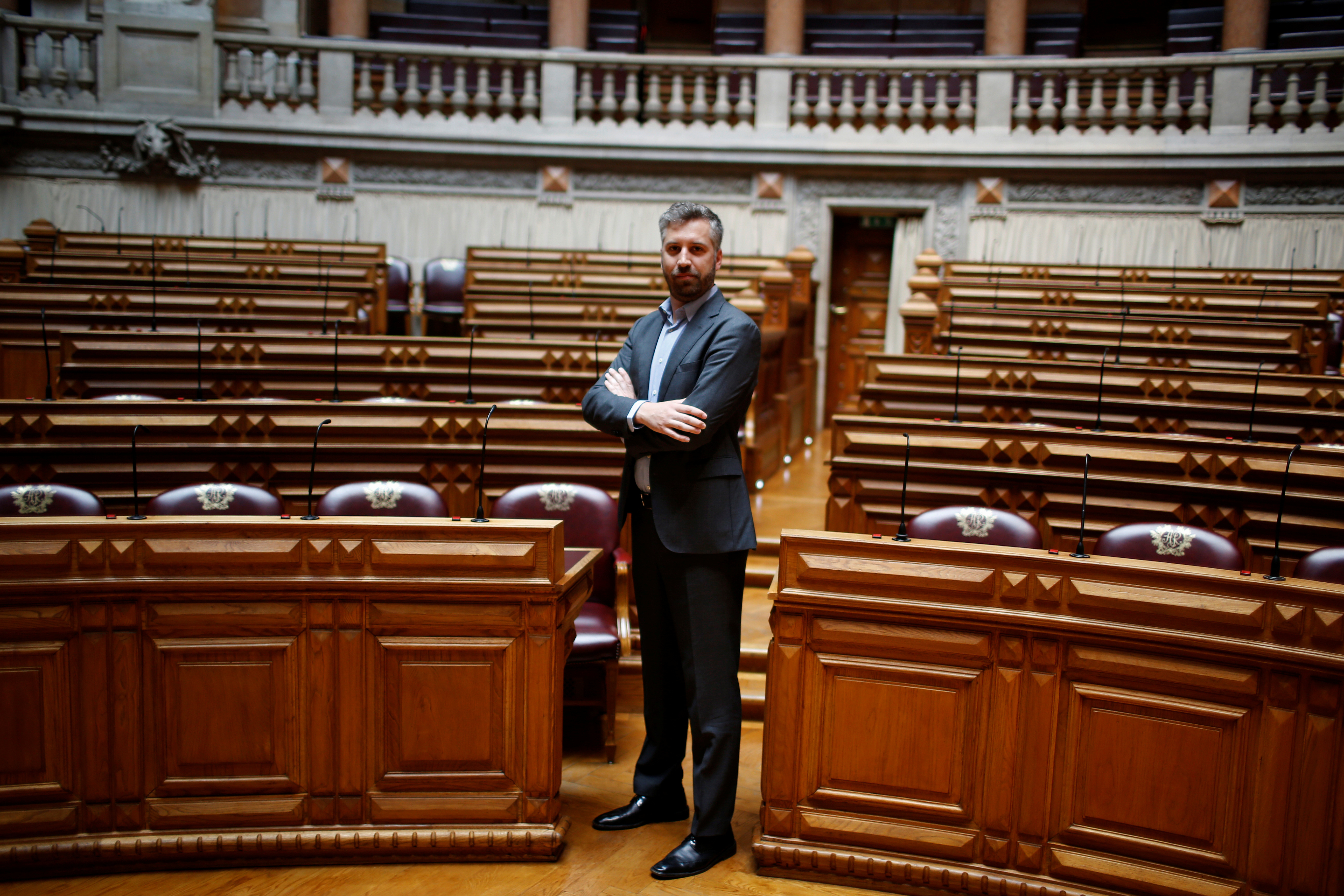 Pedro Nuno Santos poses for a portrait between the legislators of Socialist party and left bloc inside Portuguese parliament in Lisbon