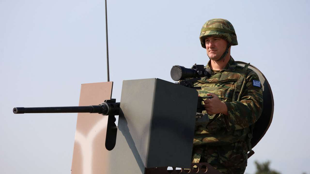A Greek soldier member of the NATO-led Kosovo Force (KFOR) stands guard at NATO’s headquarters in Pristina
