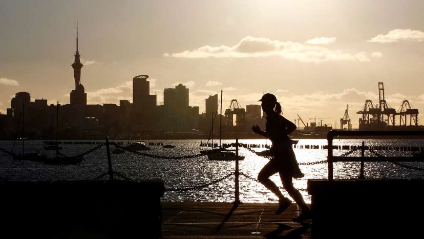 FILE PHOTO: A jogger runs along the seawall in Auckland