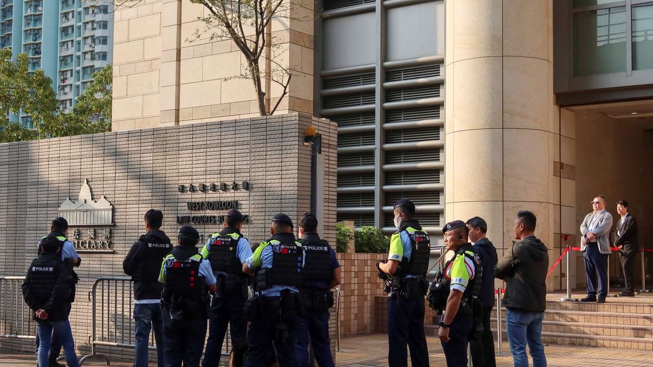 Police stand guard as twelve pro-democracy activists appeal their convictions and sentences in a landmark national security case at the West Kowloon Magistrates' Courts building, in Hong Kong