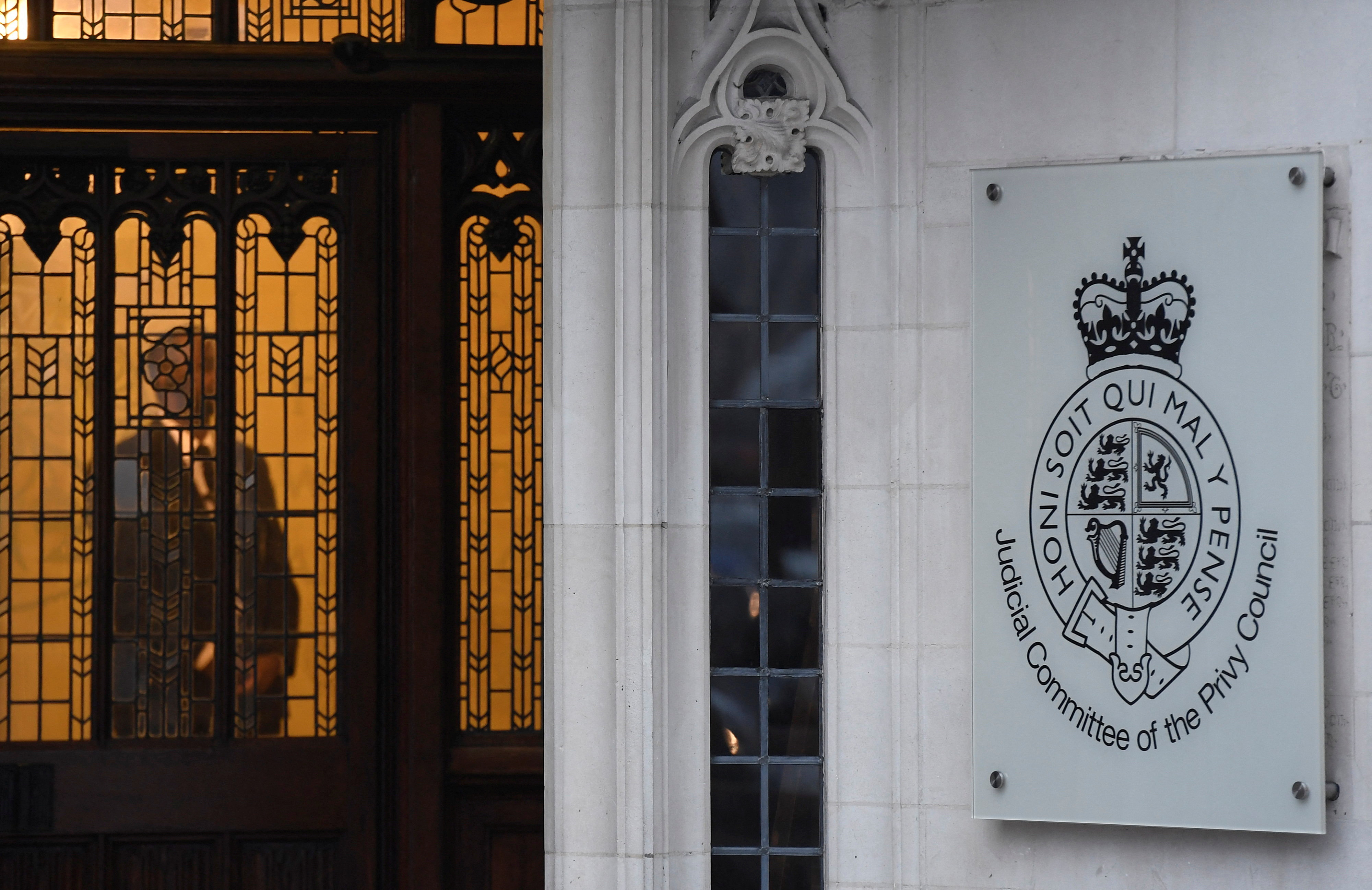 FILE PHOTO: A member of security stands guard inside the Supreme Court in London