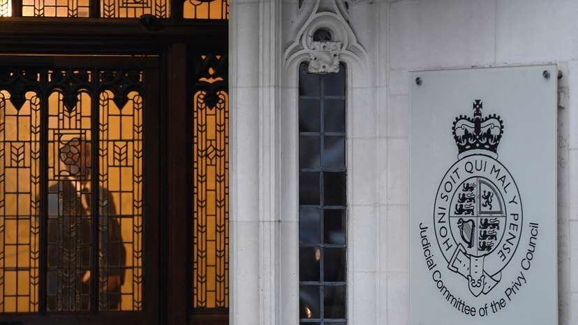 FILE PHOTO: A member of security stands guard inside the Supreme Court in London