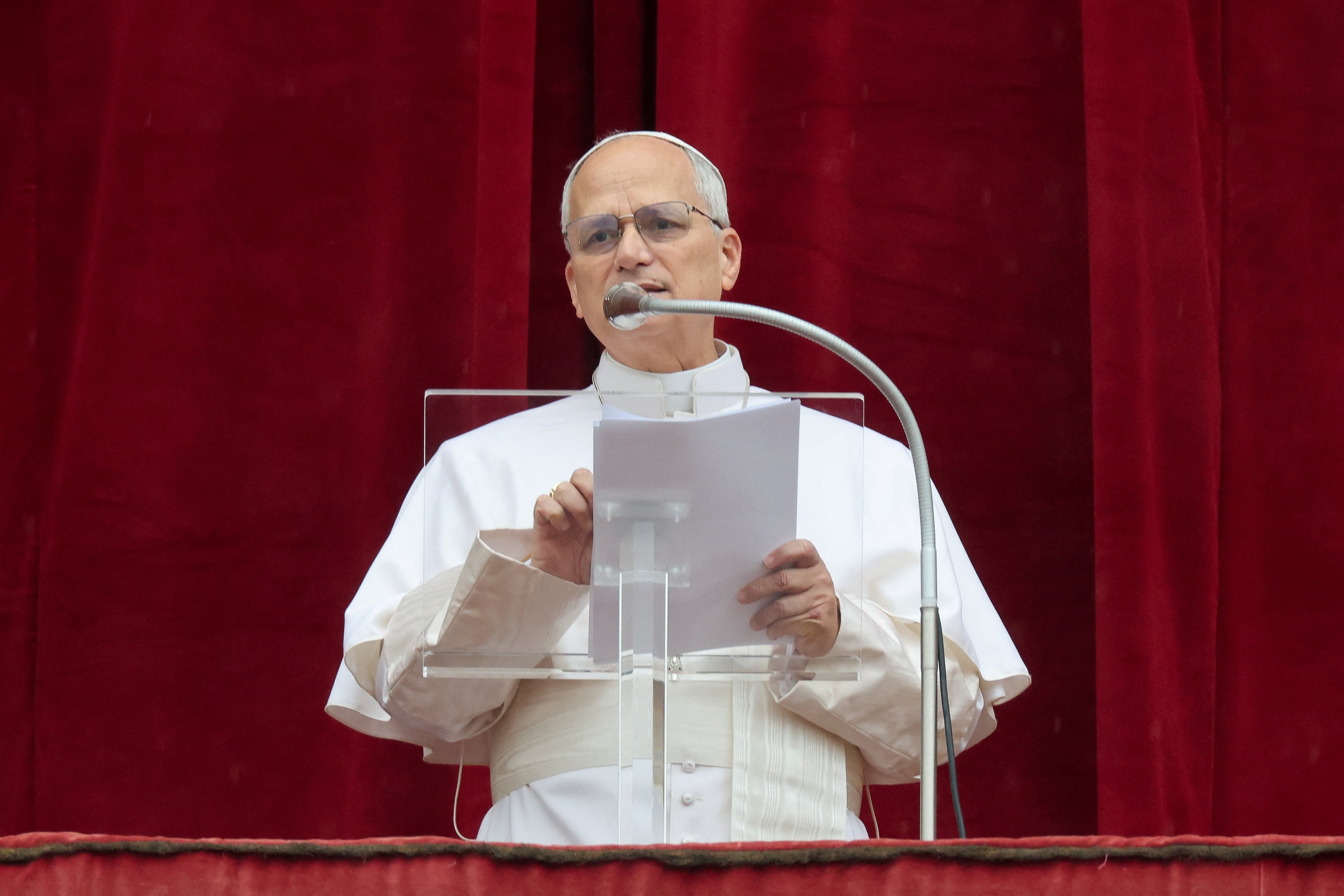 Pope Leo XIV leads the Angelus prayer from the balcony of St. Peter's Basilica, on Epiphany