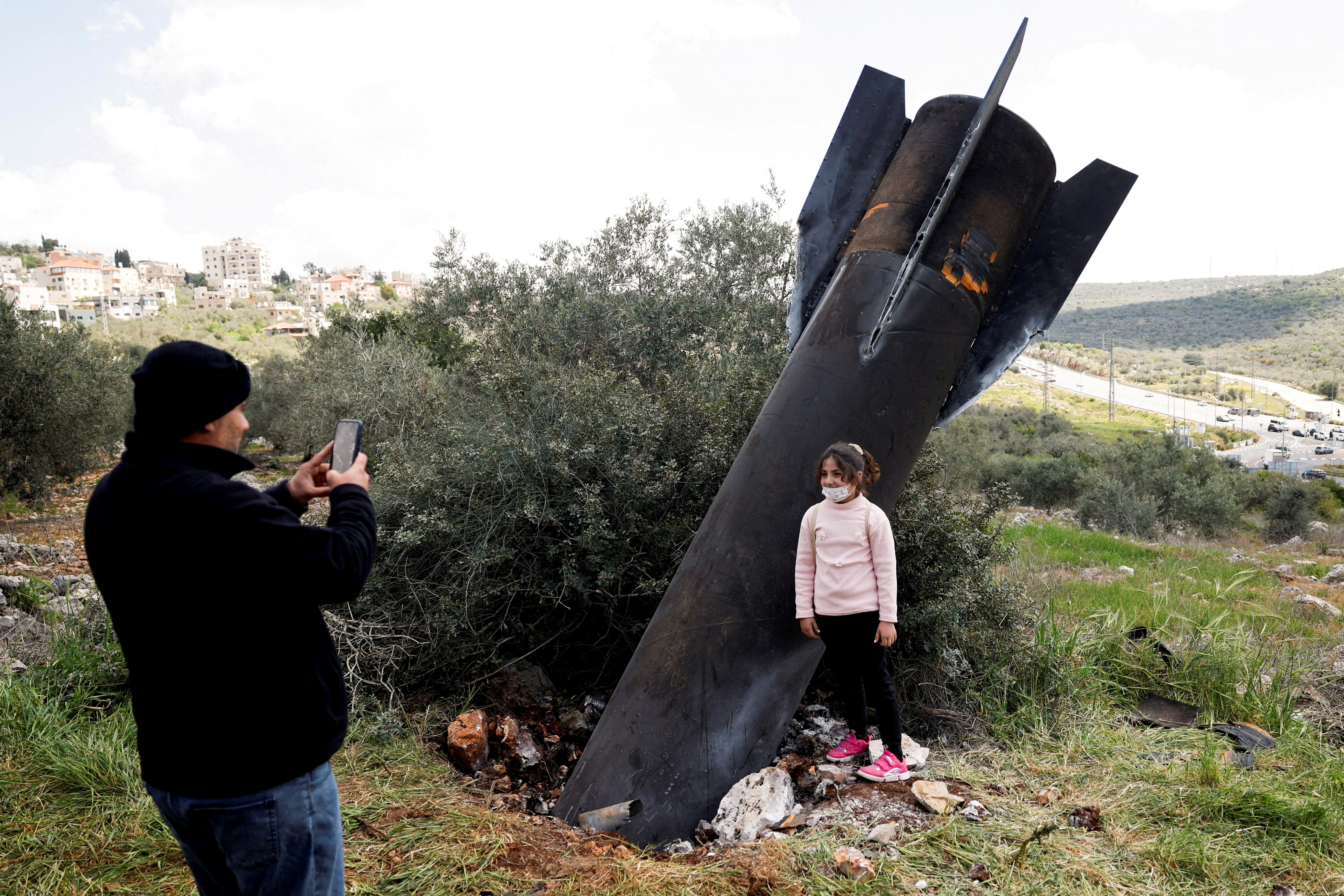 FILE PHOTO: Remnants of a missile stuck in the ground found in Kifl Haris village, near Nablus in the Israeli-occupied West Bank