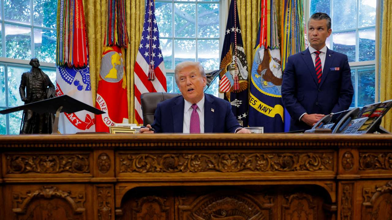 FILE PHOTO: U.S. President Donald Trump signs an executive order at the White House in Washington, D.C.
