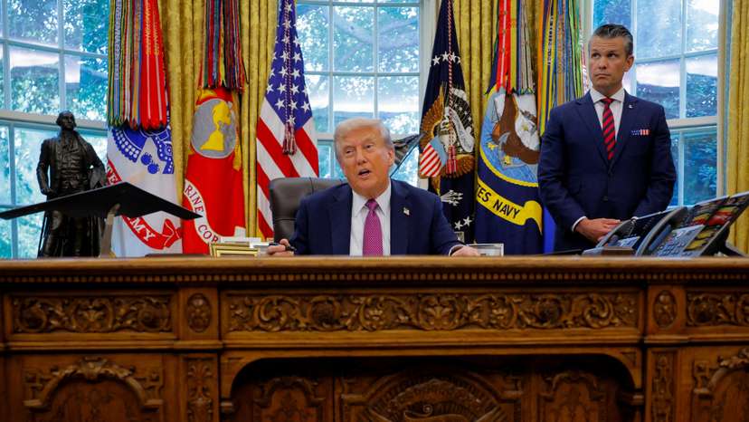 FILE PHOTO: U.S. President Donald Trump signs an executive order at the White House in Washington, D.C.