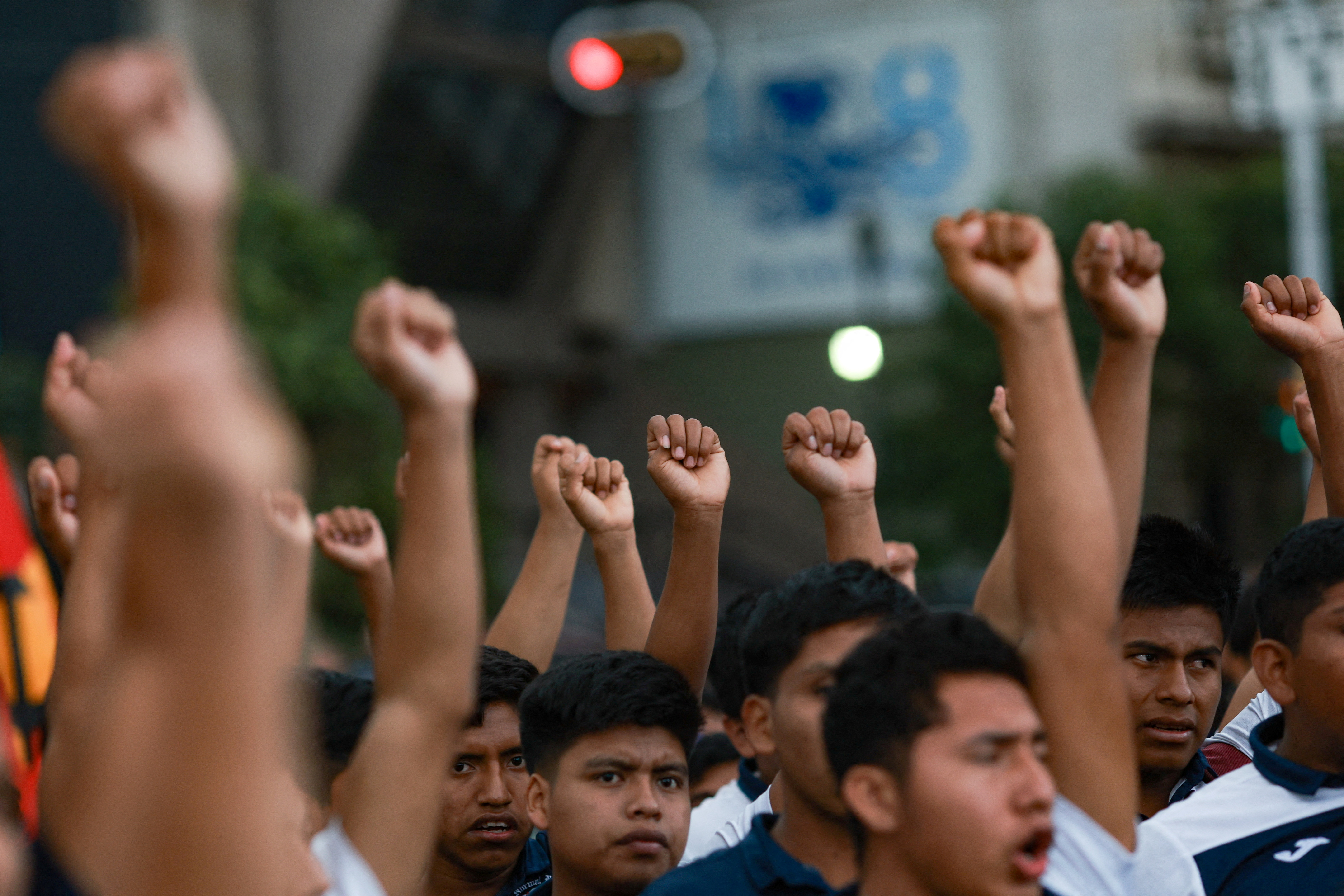 Demonstrators march to demand justice for the disappearance of students of Ayotzinapa Rural Teachers' College, in Mexico City