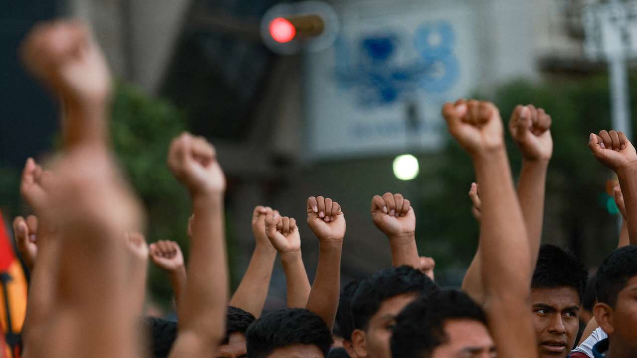 Demonstrators march to demand justice for the disappearance of students of Ayotzinapa Rural Teachers' College, in Mexico City