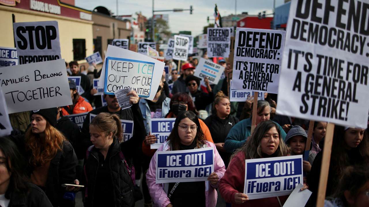 FILE PHOTO: People gather for a protest against ICE raids in Little Village, Chicago
