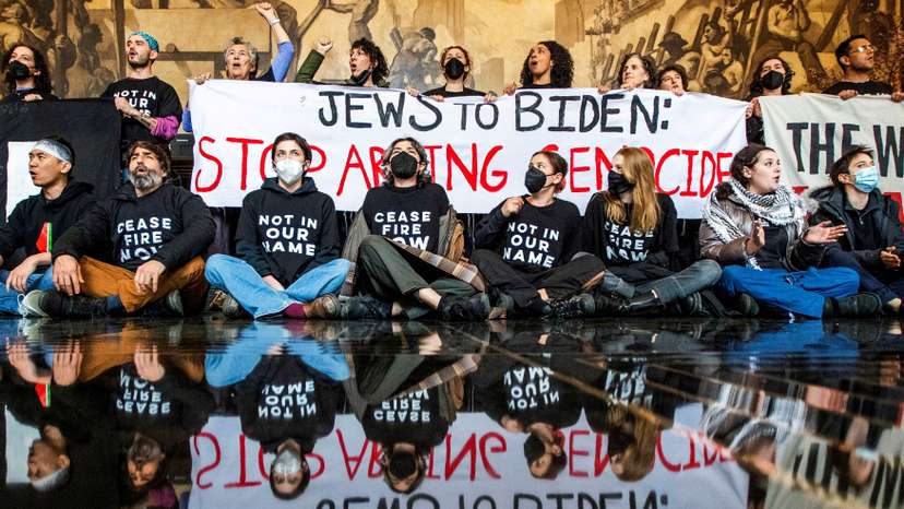 Protesters ask for a ceasefire in the ongoing conflict between Israel and the Palestinian Islamist group Hamas, as U.S. President Biden attends an interview in New York