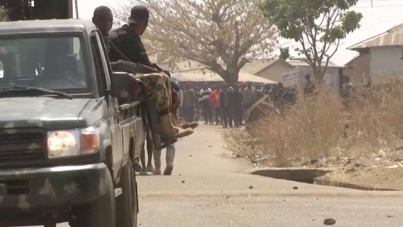 Security personnel patrol the streets amid a surge in violence in Mangu