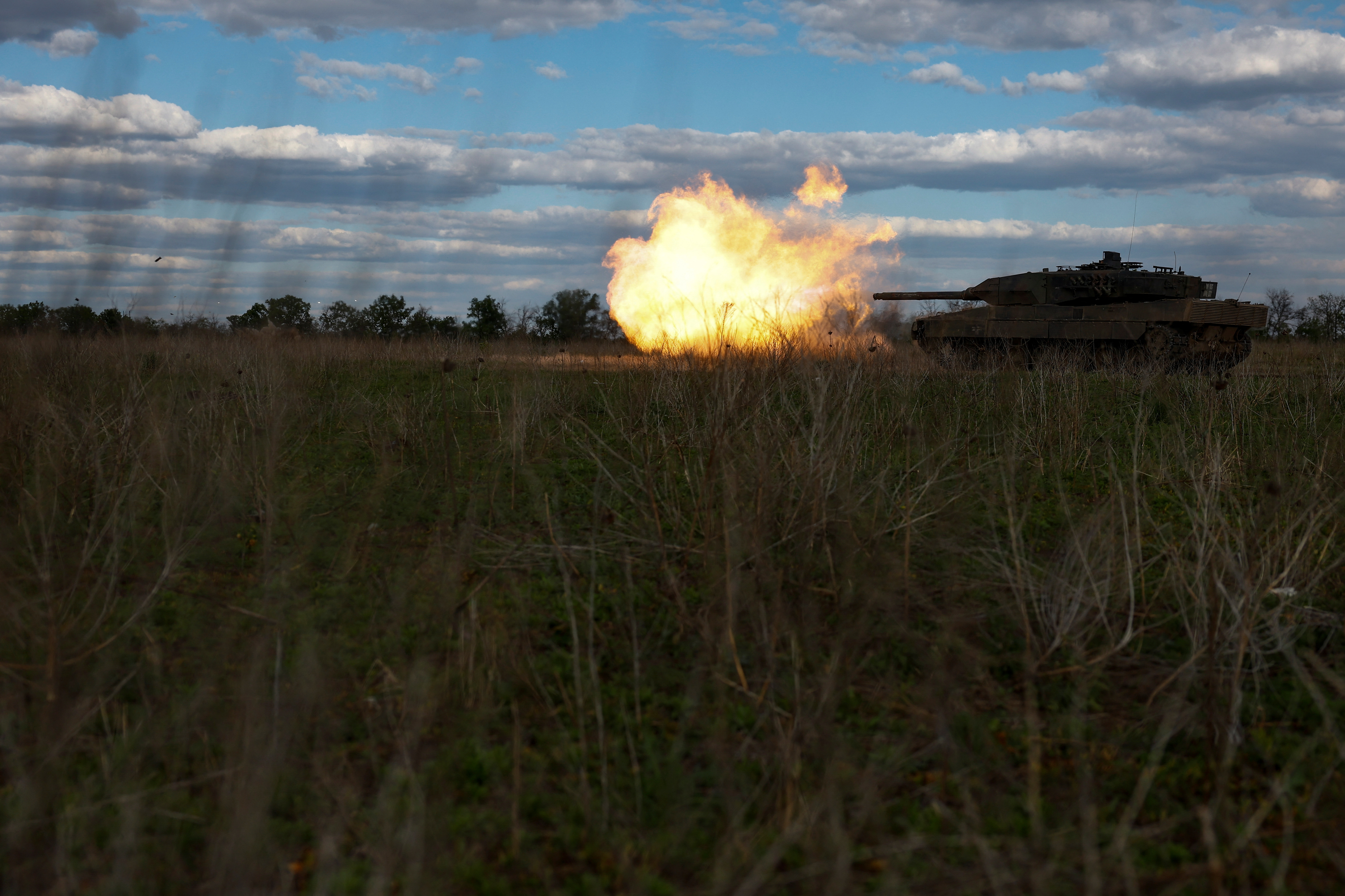 Ukrainian servicemen fire a Leopard 2A6 tank during a military exercise in Donetsk region