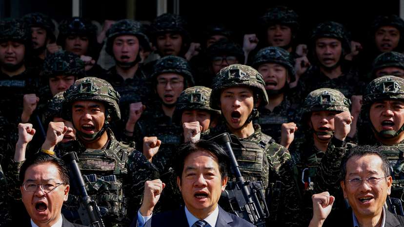 FILE PHOTO: Taiwan's President Lai Ching-te poses for a group photo at Songshan airbase in Taipei