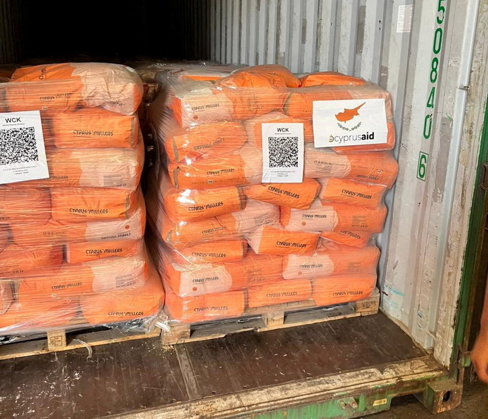 Food aid donated from Cyprus for the people of Gaza is stacked on pallets at Limassol port
