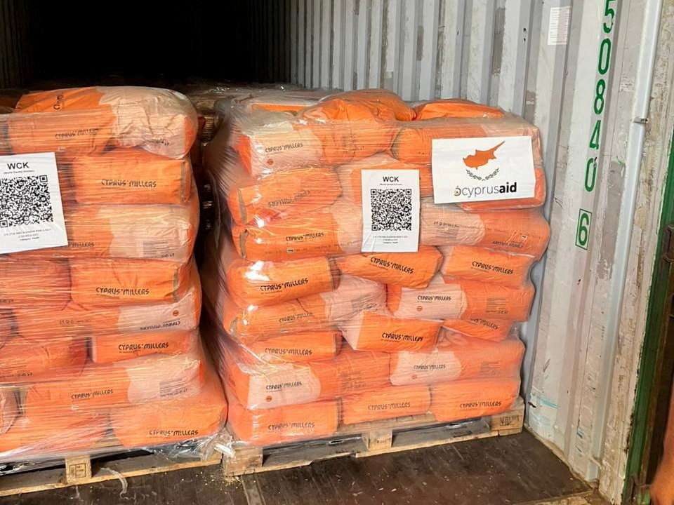 Food aid donated from Cyprus for the people of Gaza is stacked on pallets at Limassol port