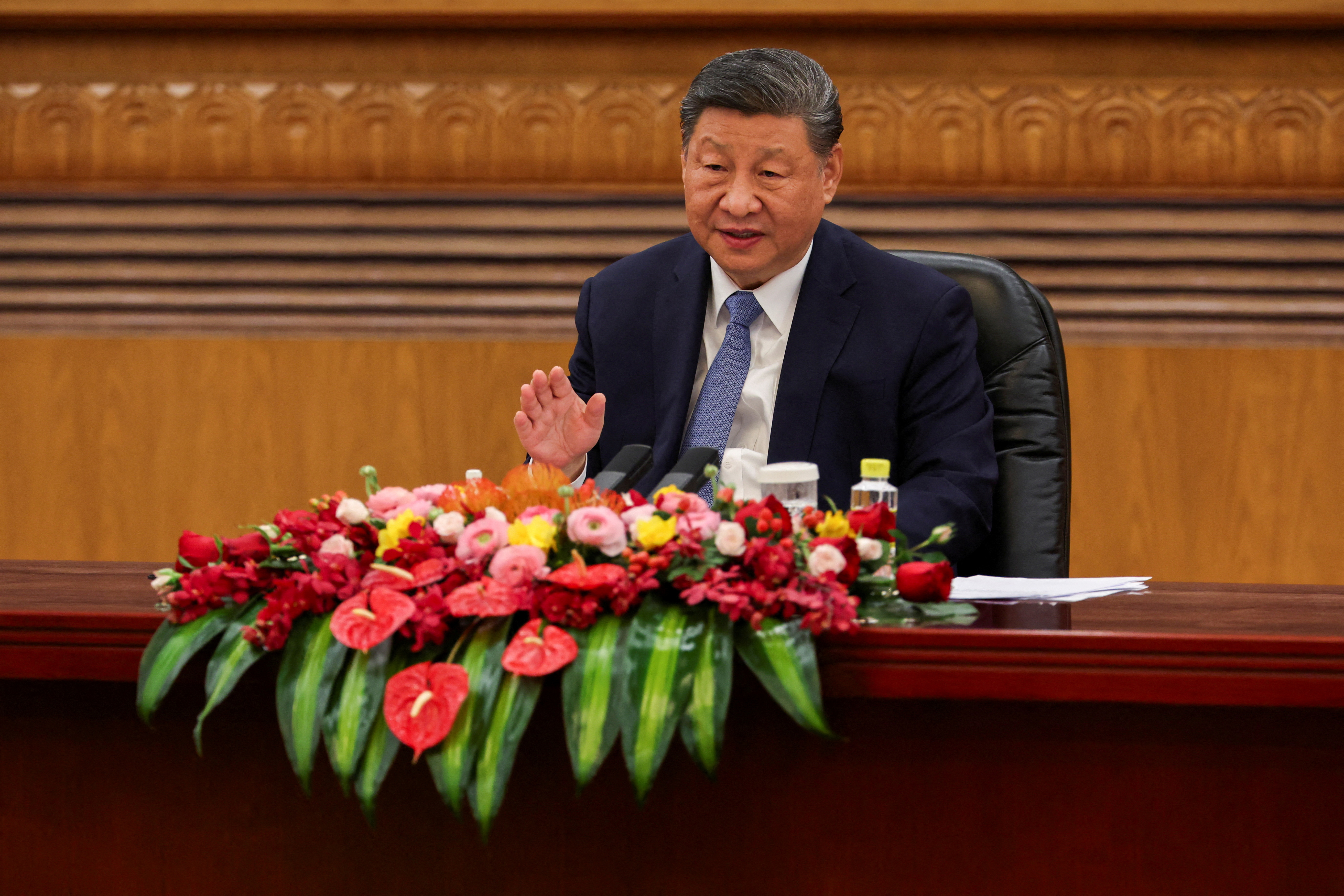 Chinese President Xi Jinping attends a meeting with foreign business leaders at the Great Hall of the People in Beijing