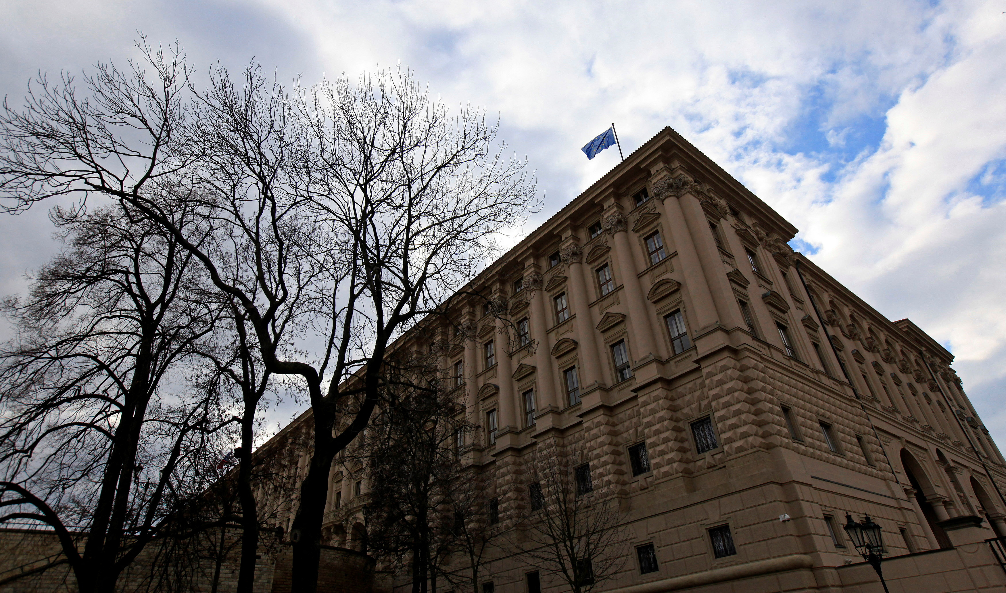 FILE PHOTO: An European Union flag flutters on the Czech Foreign Ministry headquarters before an extraordinary Visegrad Group summit in Prague