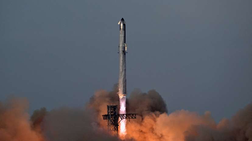 A SpaceX Super Heavy booster carrying the Starship spacecraft lifts off on its 10th test flight