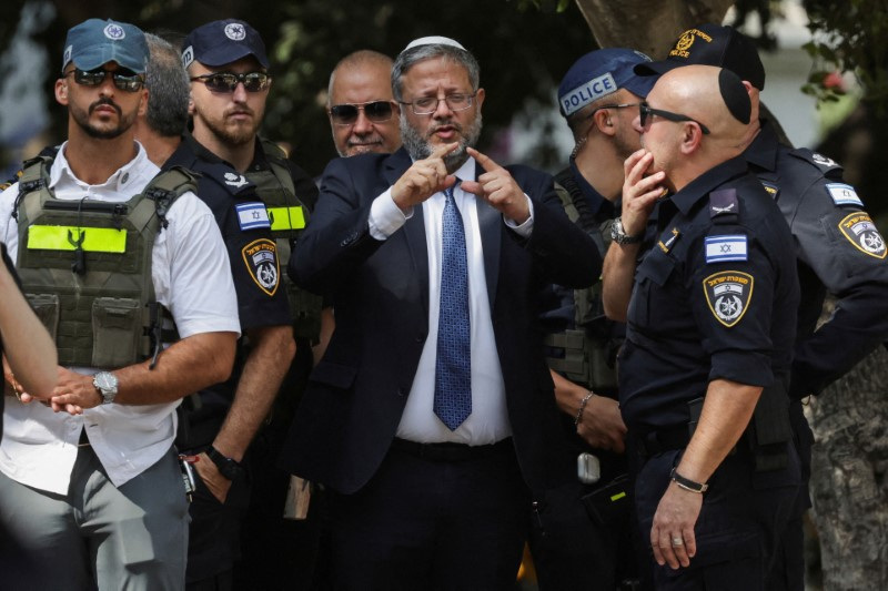 FILE PHOTO: Israel's National Security Minister Itamar Ben-Gvir talks to emergency responders at the scene of a suspected stabbing attack in Holon