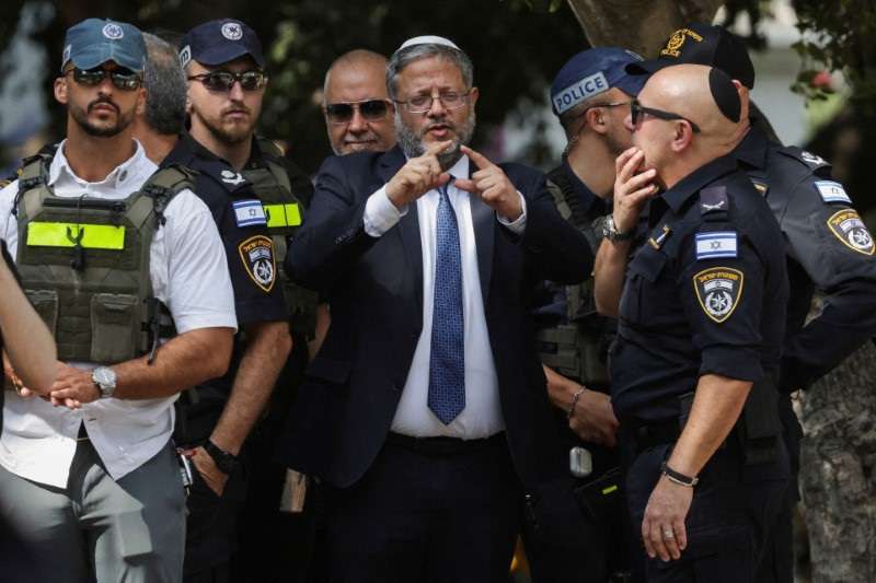 FILE PHOTO: Israel's National Security Minister Itamar Ben-Gvir talks to emergency responders at the scene of a suspected stabbing attack in Holon