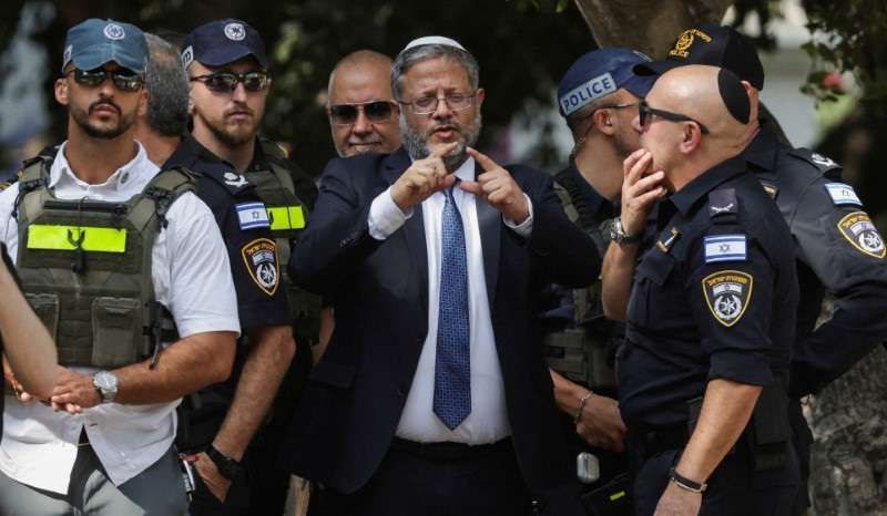 FILE PHOTO: Israel's National Security Minister Itamar Ben-Gvir talks to emergency responders at the scene of a suspected stabbing attack in Holon