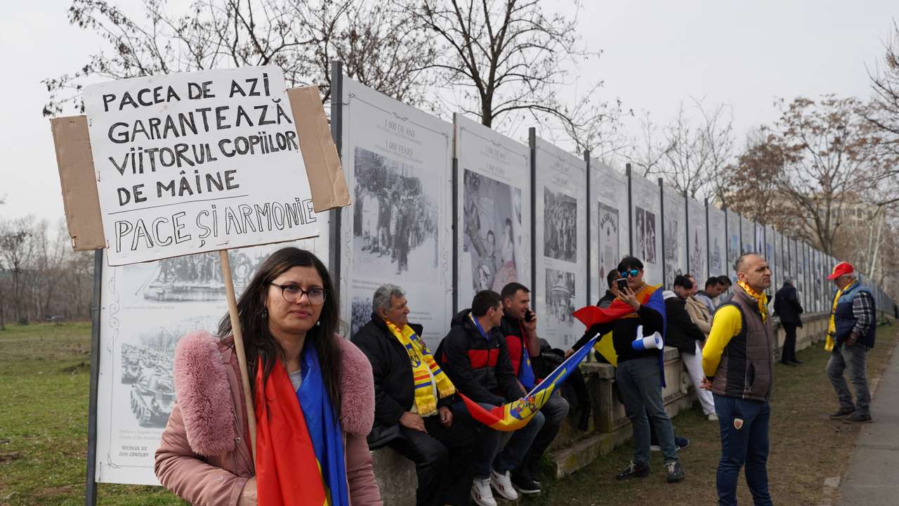 Cornelia Borta holds a placard during a protest in front of the Constitutional Court of Romania