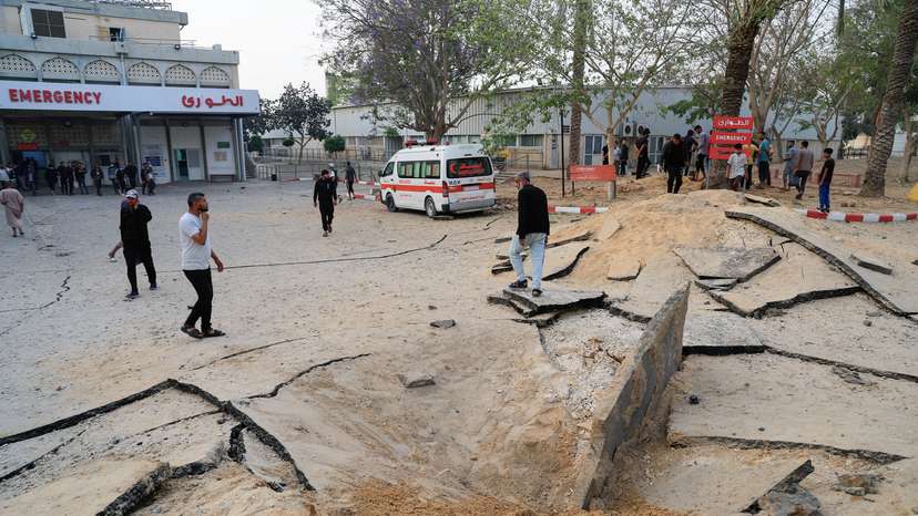 Palestinians inspect the damage at the European Hospital, in Khan Younis
