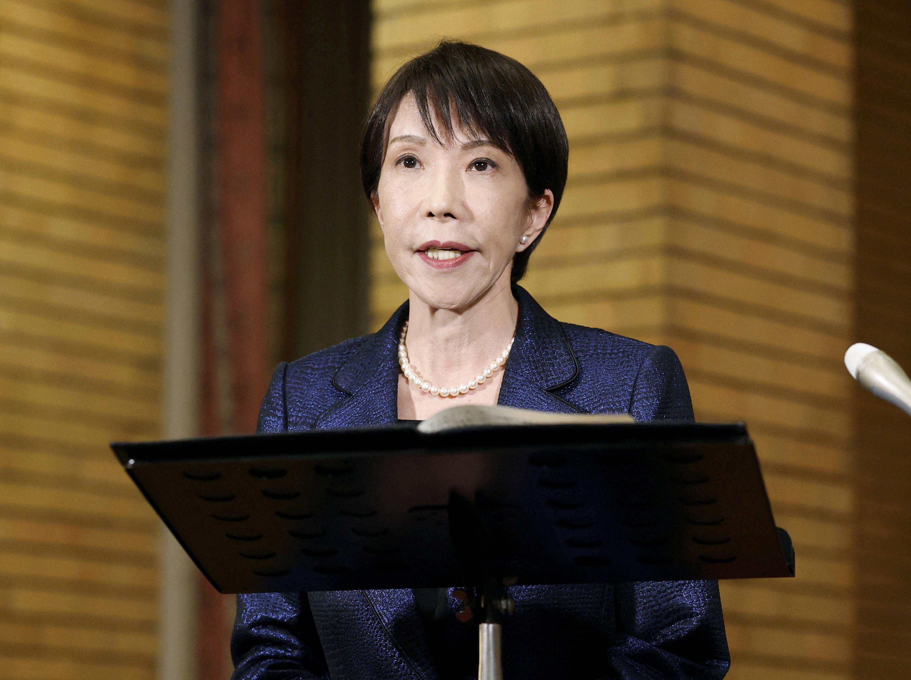 Japan's Prime Minister Sanae Takaichi speaks to media about Japan's plan to release part of oil reserves in Tokyo