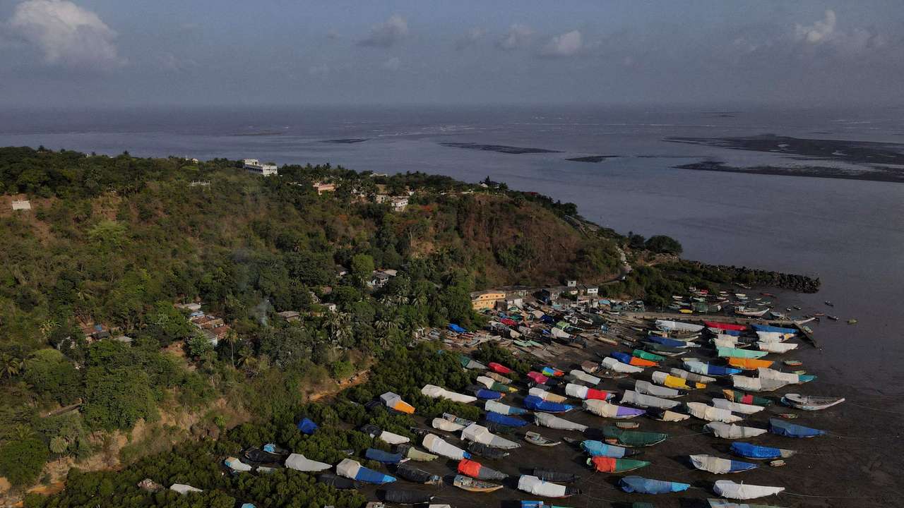 FILE PHOTO: An aerial view of fishing boats covered with tarpaulin sheets parked on the shore, before the start of the monsoon season, on the outskirts of Mumbai