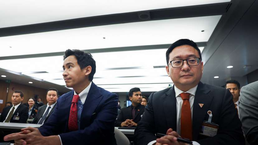 Former Move Forward Party leader Pita Limjaroenrat and party's members sit on the day Thailand's Constitutional Court delivers its verdict on election winner's bid to amend a law against insulting the monarchy, in Bangkok