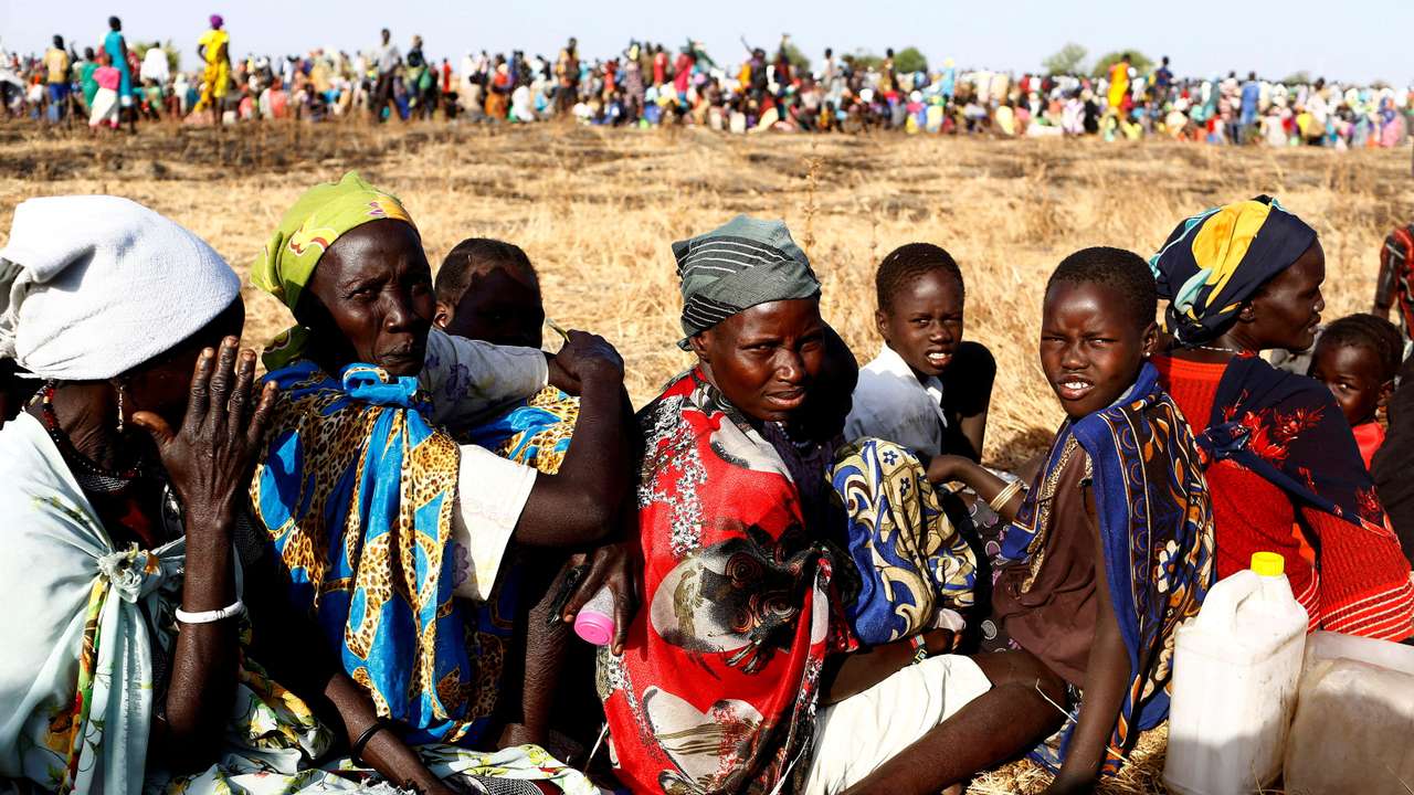 FILE PHOTO: Women and children wait to be registered prior to a food distribution carried out by the United Nations World Food Programme (WFP) in Thonyor, Leer state, South Sudan