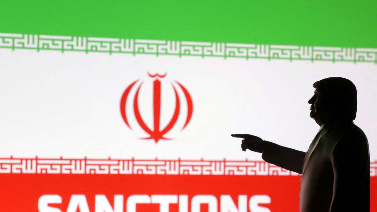 FILE PHOTO: Illustration shows 3D-printed miniature model depicting U.S. President Donald Trump, Iran flag and word "Sanctions\