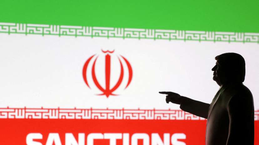FILE PHOTO: Illustration shows 3D-printed miniature model depicting U.S. President Donald Trump, Iran flag and word "Sanctions\