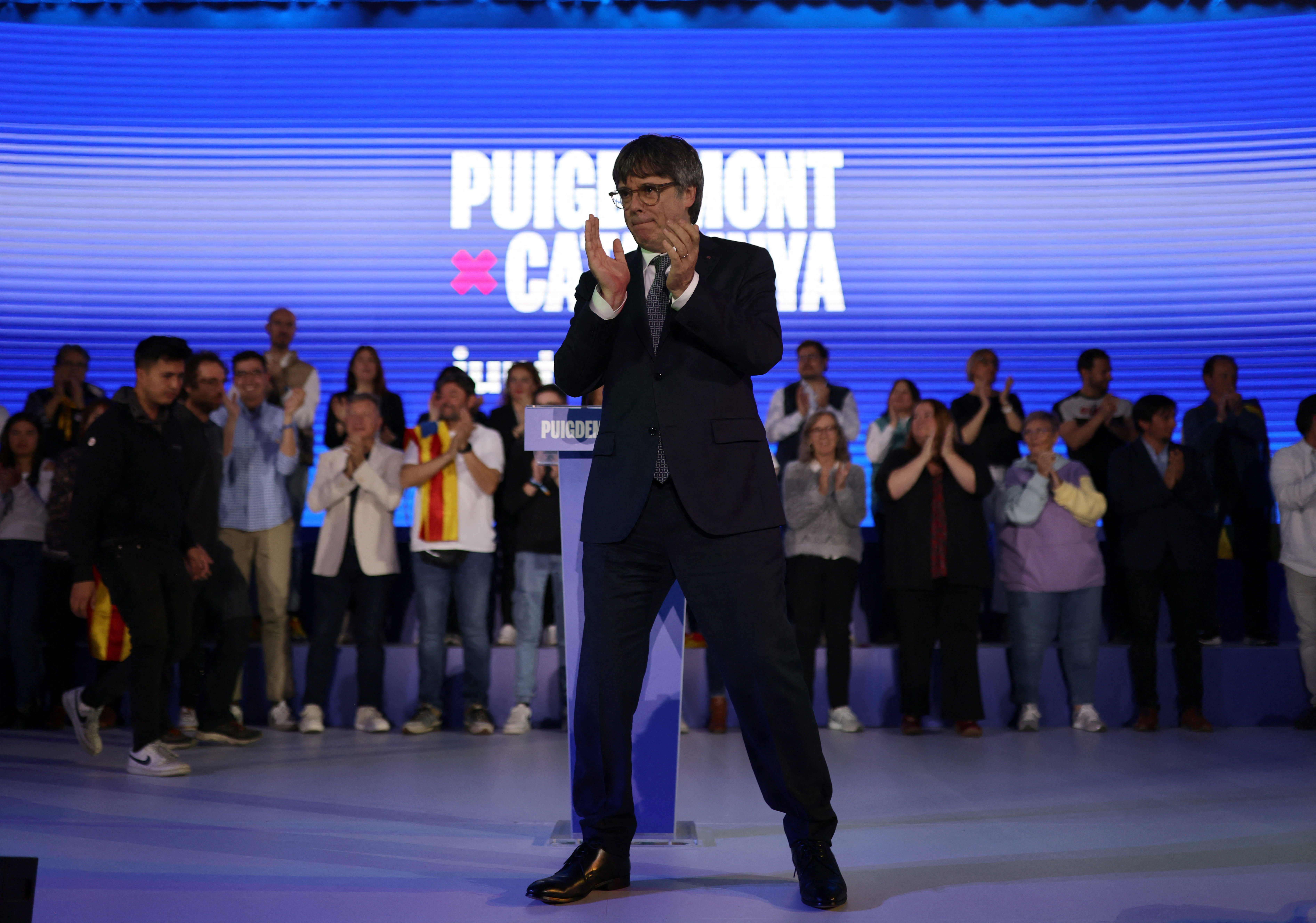 Facing Spanish arrest warrant, Catalan politician campaigns from France