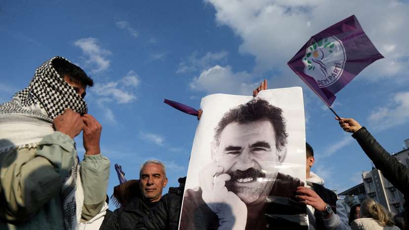 FILE PHOTO: A demonstrator holds a picture of jailed Kurdish militant leader Ocalan