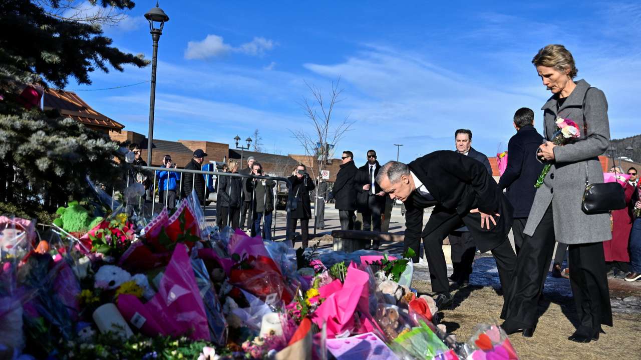 Canada's Prime Minister Mark Carney visits a makeshift memorial, after a mass shooting in the town of Tumbler Ridge