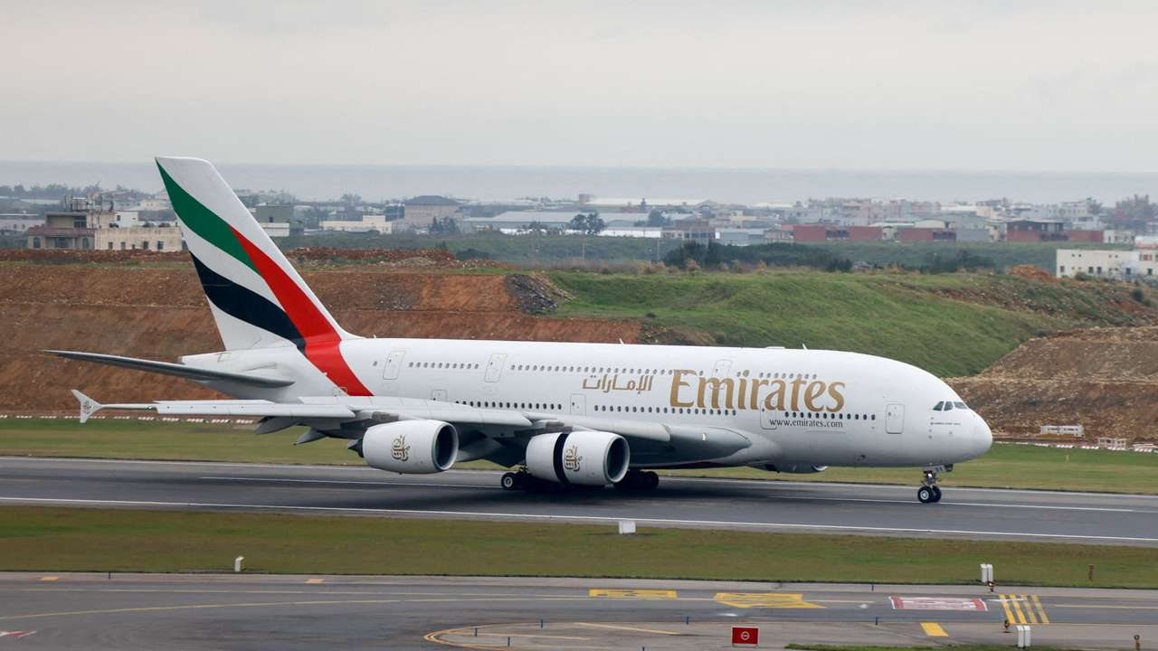 FILE PHOTO: An Emirates flight departing from Dubai lands at Taoyuan International Airport in Taoyuan