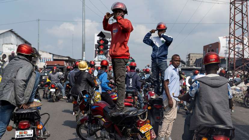 Activists march during a demonstration calling for an end to the fighting between the M23 rebels and the Congolese army and denouncing the international community's silence on the conflicts in Goma