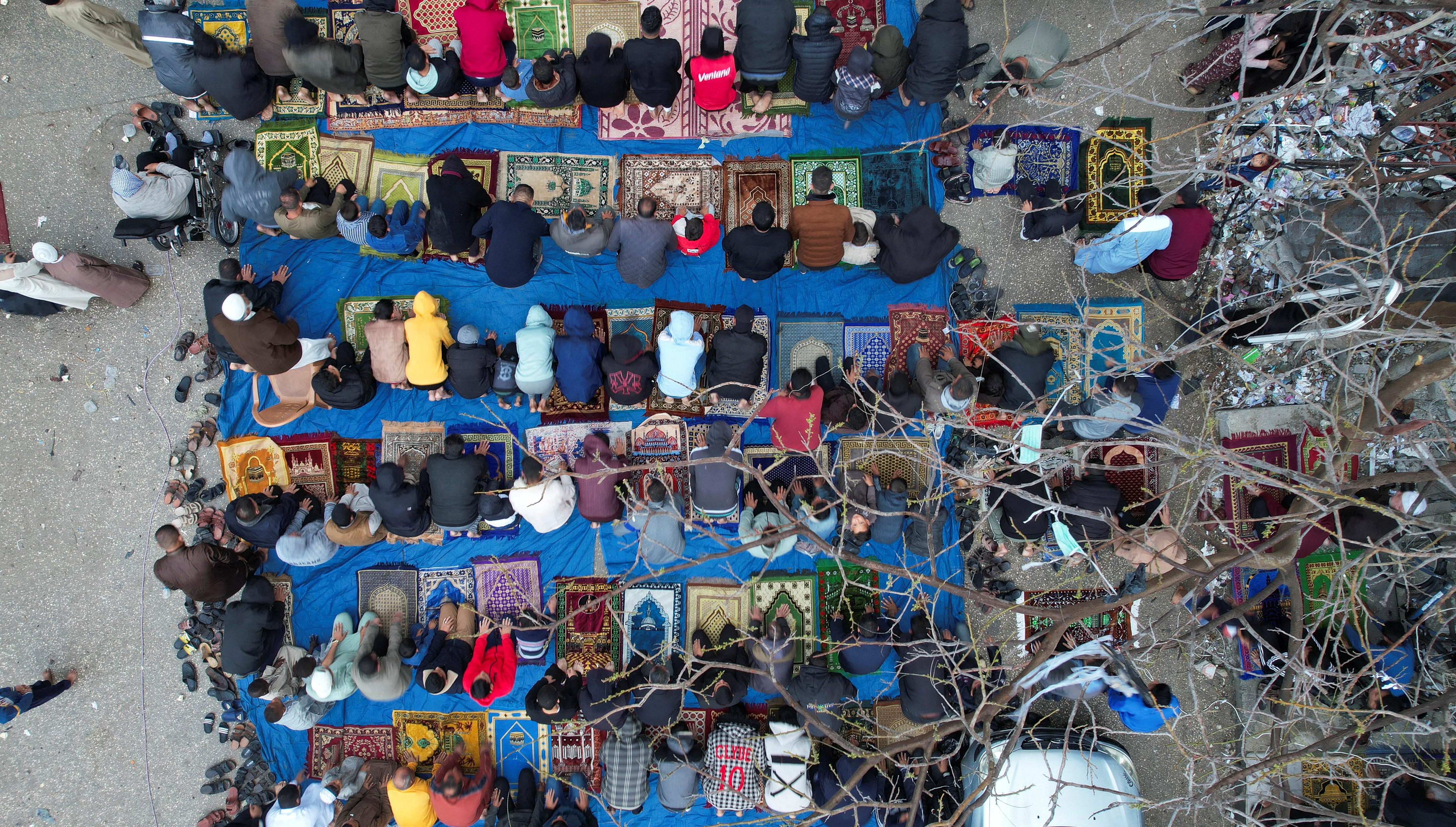 Palestinians hold Eid al-Fitr prayers by the ruins of al-Farouk mosque in Rafah