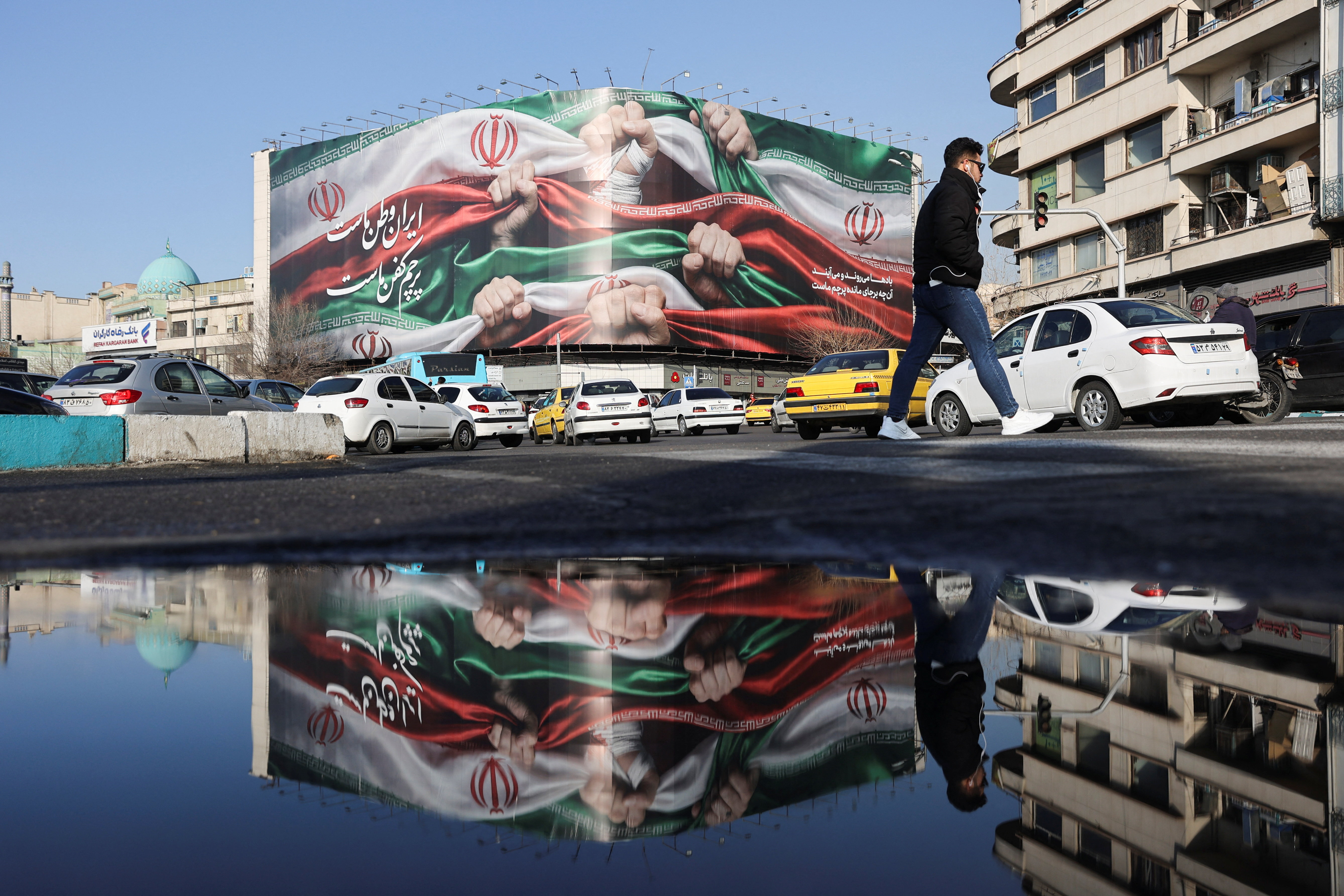 A billboard with a picture of Iran's flag, on a building in Tehran