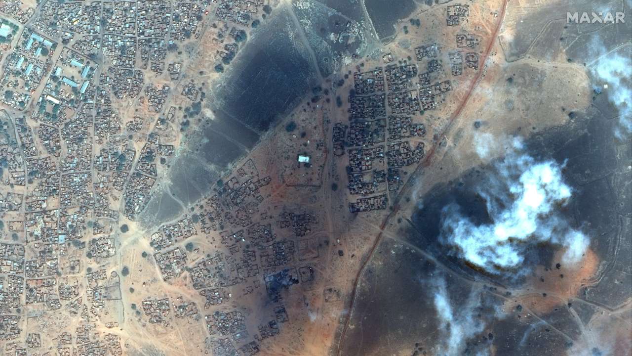 Satellite image shows smoke rising in Zamzam Camp in North Darfur