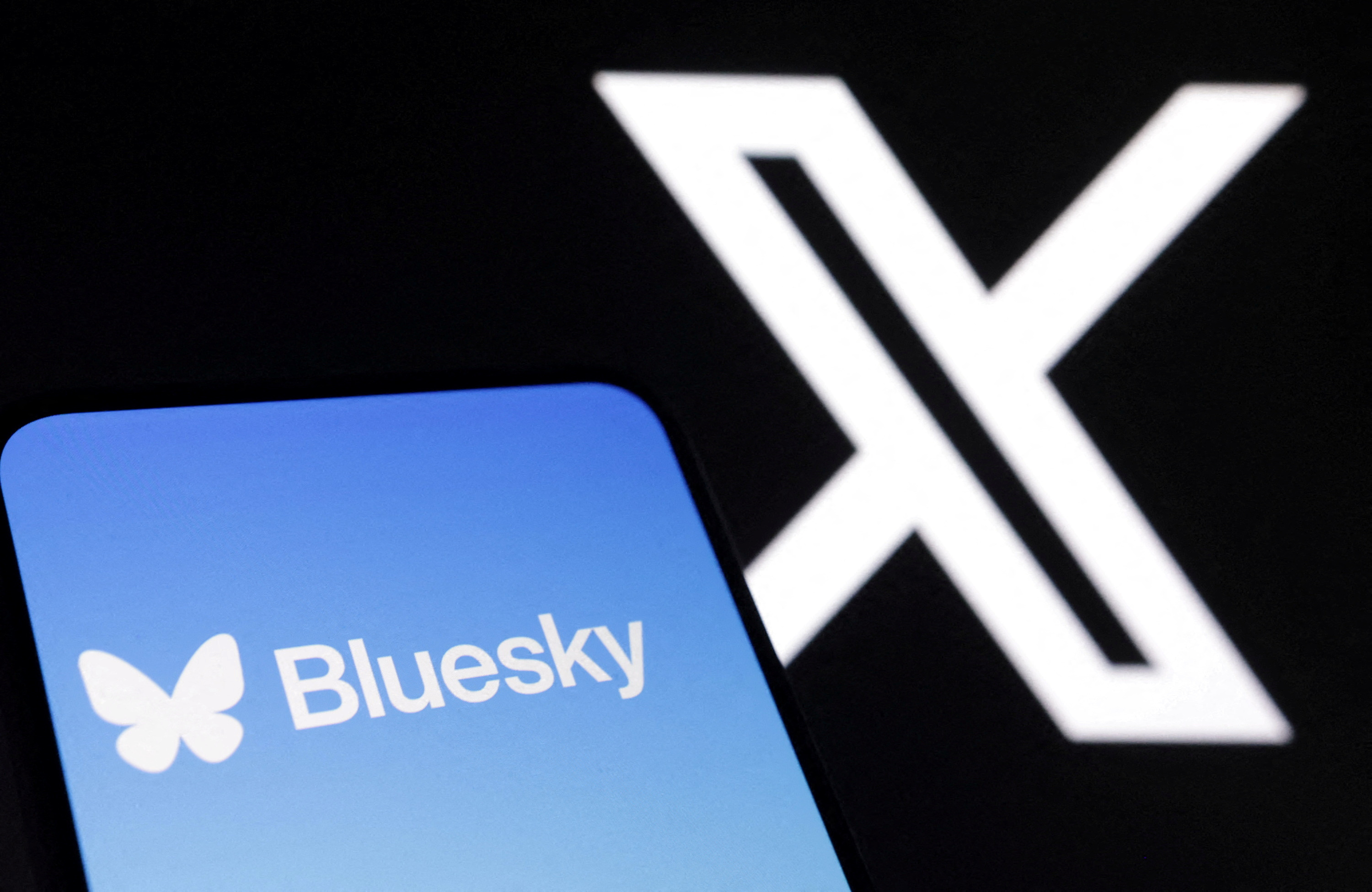FILE PHOTO: Illustration shows Bluesky and X app logos
