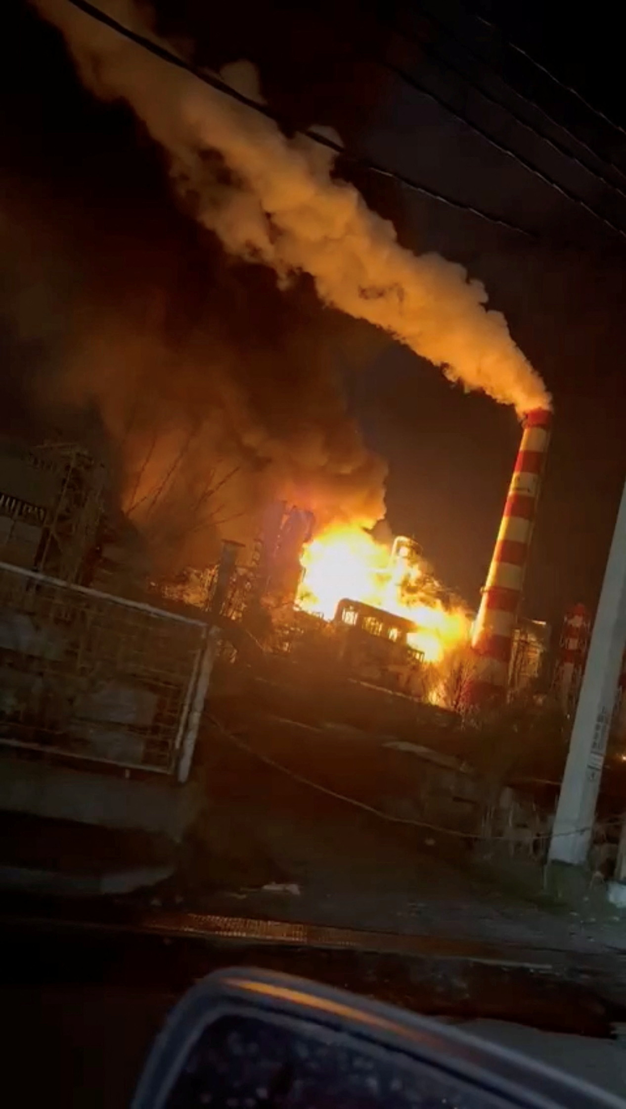 Smoke and flames rise after a fire broke out at a large oil refinery in Tuapse