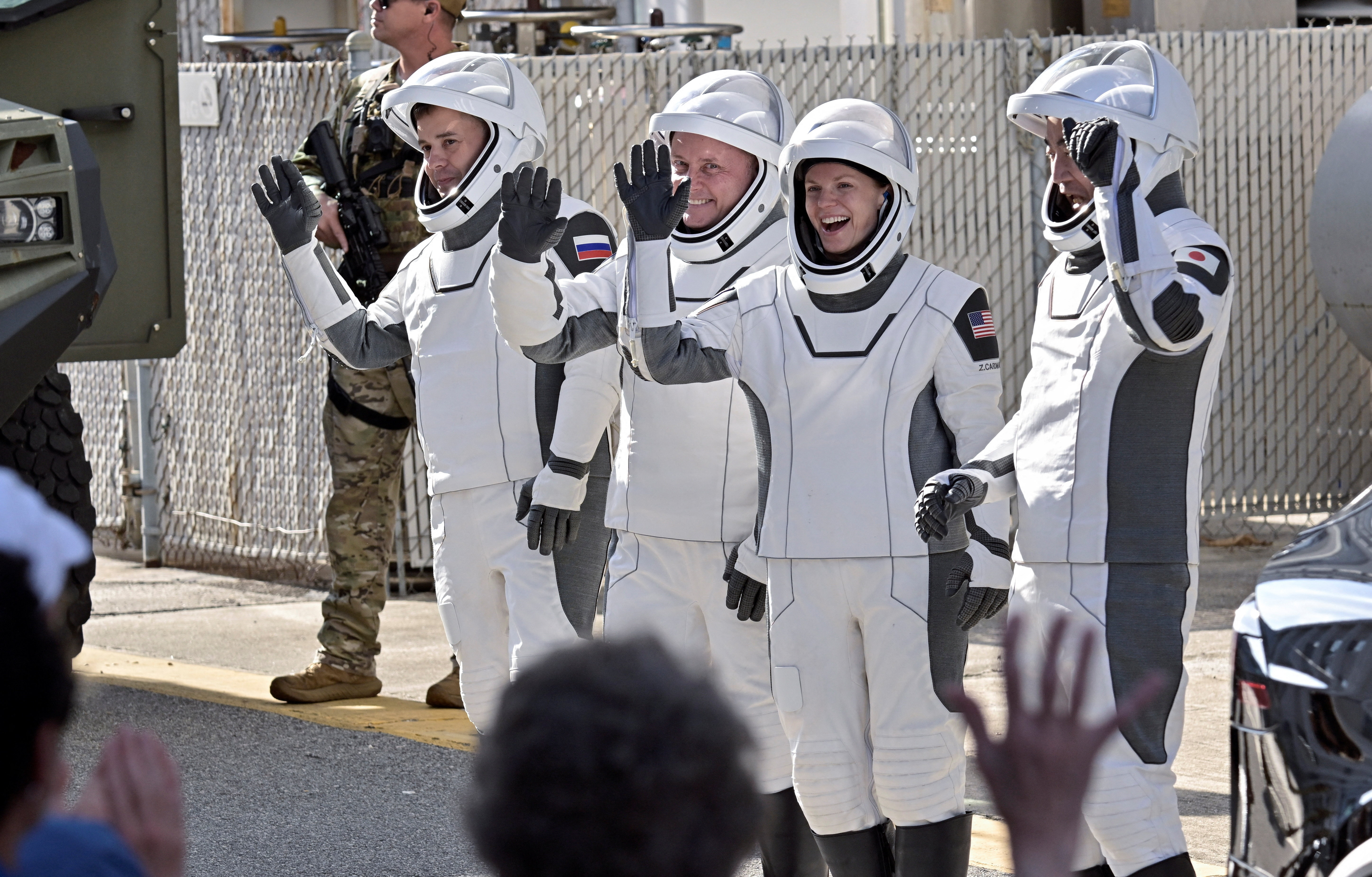 NASA's SpaceX Crew-11 crew members walk from the Operations and Checkout Building at the Kennedy Space Center for transport to Launch Complex 39-A