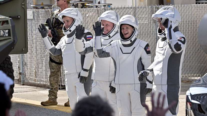 NASA's SpaceX Crew-11 crew members walk from the Operations and Checkout Building at the Kennedy Space Center for transport to Launch Complex 39-A